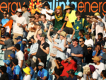 Fans enjoy a game of cricket