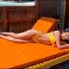 Shifa Jowhar slips into a yellow bikini and relaxes alongside the beach