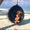 Gorgeous gal enjoys the scenic beauty of Maldives beach by swinging in a Jhula