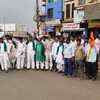JD(S) and Congress workers stage protest by blocking a main road in Hubballi.