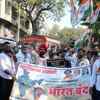Mumbai: Congress party activists led by former MLC Charan Singh Sapra take out a march in Mulund and asked shopkeepers to down shutters and also vegetable hawkers who are off roads since early morning.