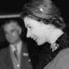 Queen Elizabeth in a bell-cuffed fur trimmed coat