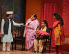 Nagpurians watch a play at an auditorium, after nine months