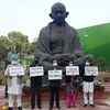 Congress MPs from Punjab protest at Gandhi Statue at the Parliament premises over farmers' issue.