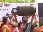 Women carry gas cylinders