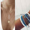 Layered necklaces and bracelets