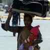 Migrant workers move from Gurugram to their native villages.