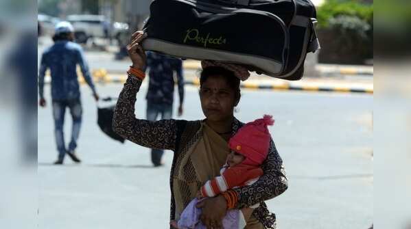 Migrant workers move from Gurugram to their native villages.
