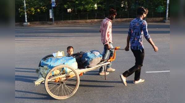 Migrant workers move from Gurugram to their native villages.