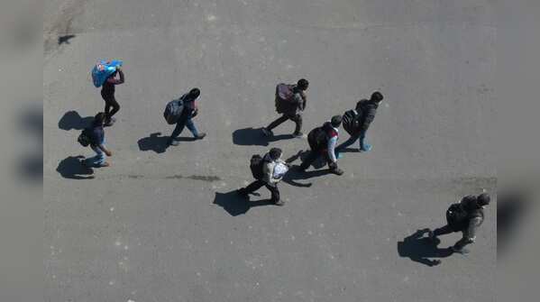 Migrants walking towars Noida Gate near Mayur Vihar during lockdown in Delhi.