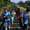 A family walks from Sion, Mumbai to reach for their home village in Mangaon, Maharashtra