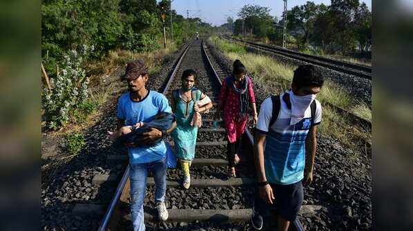 A family walks from Sion, Mumbai to reach for their home village in Mangaon, Maharashtra