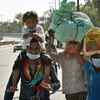 Migrant workers head home on the fourth day of national lockdown at Barapula flyover in Delhi