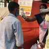 Assam: Temperature of voters being checked, arrangement of masks, gloves, and hand sanitiser made at a primary school - designated as a polling booth - in Dibrugarh