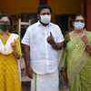 Aruvikkara UDF candidate and sitting MLA Sabarinathan after casting his vote along with his wife and mother at NSS school, Shasthamangalam