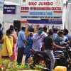A notice place of no vaccine at BKC jumbo vaccination centre after it was a shortage of vaccines and people wait outside the centre and empty chairs of the centre in Mumbai on Friday.