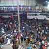 Delhi: Migrant workers throng Anand Vihar Bus Terminal after the National Capital goes into 1-week lockdown starting tonight at 10 pm