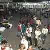 Delhi: Migrant workers wait for buses at Anand Vihar Bus Terminal amid 1-week lockdown in NCT