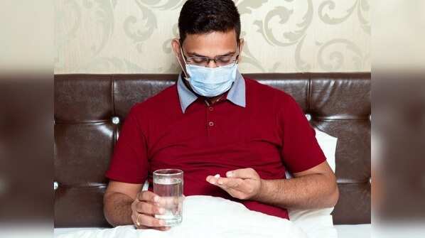 What should you do if you test negative but still show symptoms?