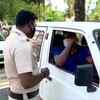 Kerala: Police check vehicular movement as restrictions similar to lockdown has been imposed in the state on the weekend; only essential services allowed. Visuals from Thiruvananthapuram.