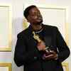 Daniel Kaluuya proudly poses with his Academy Award