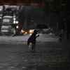 Cyclone Tauktae: A man crosses the waterlogged King's Circle in Mumbai on Monday evening.