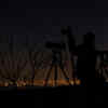 A photographer prepares to take pictures of the penumbral eclipse of the moon in Santiago (AFP photo)