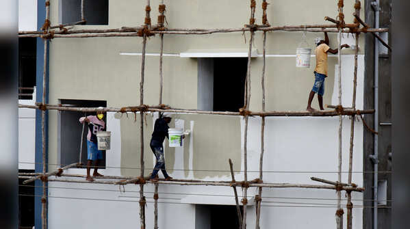 A group of painters busy painting to a new apartment