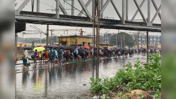 Rain batters Kolkata: Photos of waterlogged streets, rail tracks