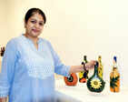 Art lovers attend an exhibition on bottle art and freehand mandalas
