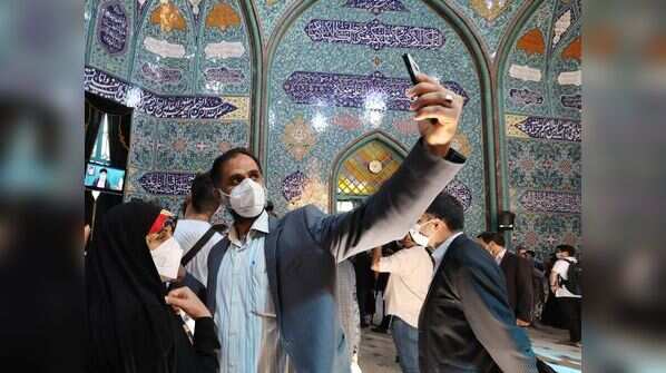 Iranian voter takes selfie after casting his vote