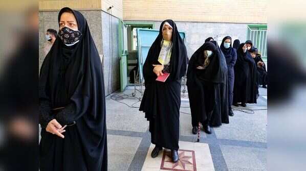 Iranian women line up to cast their vote