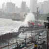 Article image for: Mumbaikars enjoy a rainy evening at Marine Drive