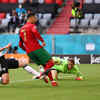 * Portugal's Cristiano Ronaldo scores their first goal. (Reuters Photo)