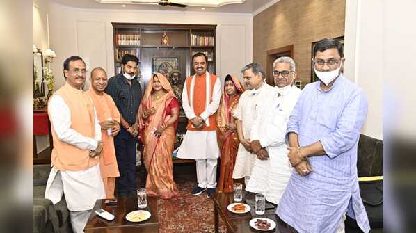 Photos: All’s well? Keshav Prasad Maurya’s lunch for Yogi Adityanath