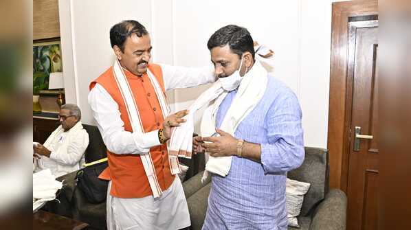 Photos: All’s well? Keshav Prasad Maurya’s lunch for Yogi Adityanath