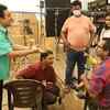 Jethalal aka Dilip Joshi and others playing with the baby on set