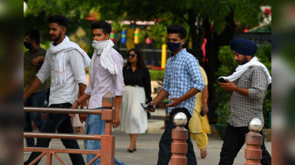 Photos: Masks slip as India ignores Covid norms
