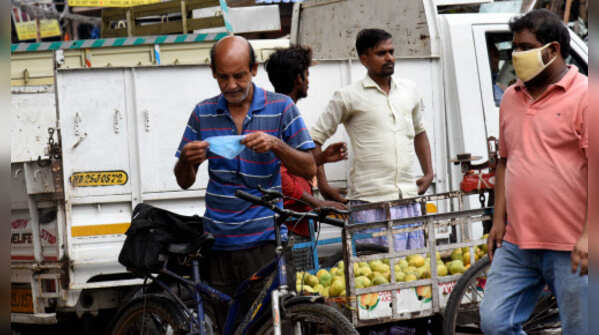 Photos: Masks slip as India ignores Covid norms