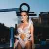 Article image for: Doja Cat’s hot extraterrestrial outfits in new track ‘Planet Her’ are out of this world.