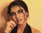 ‘Wink Girl’ Priya Prakash Varrier stuns internet in a black dress with a plunging neckline for a photoshoot