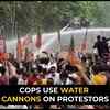 Article image for: Chandigarh: Cops use water <i class="tbold">cannon</i>s to disperse protestors at CM’s residence
