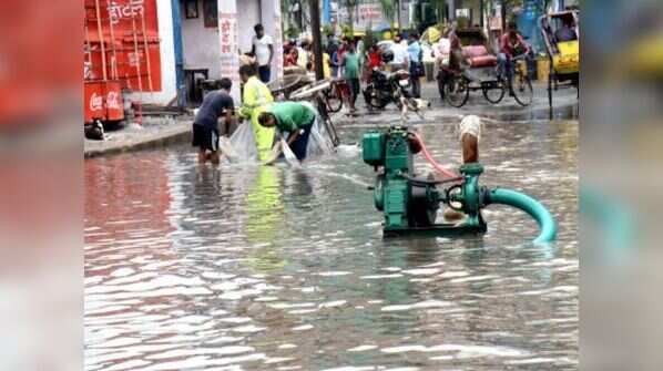PMC workers drain waterlogged rain water