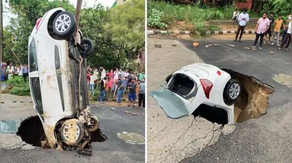 car got stuck after a road caved in Dwarka