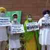 Shiromani Akali Dal (SAD) MPs protest over the three farm laws and show placards to agriculture minister Narendra Singh Tomar at the Parliament premises.