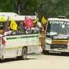 Buses, carrying farmers, arrive at Jantar Mantar in Delhi.