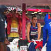 Rain halts discus throw final