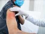How does an adverse reaction differ from a mild one?