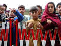 35 pictures of Afghan refugees housed in temporary shelters