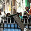 Riot victims stand behind a makeshift barrier at Shiv Vihar (Photo: BCCL)